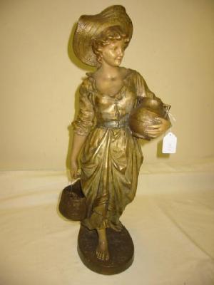 Appraisal: A GOLDSCHEIDER POTTERY FIGURE modelled as a maiden carrying a