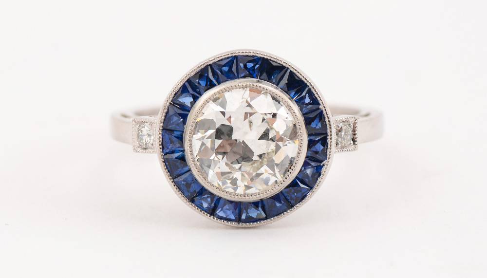 Appraisal: PLATINUM SOPHIA D DIAMOND SAPPHIRE RING At the center is