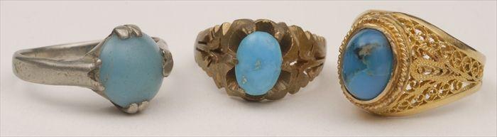 Appraisal: THREE RINGS SET WITH BLUE STONES in a gold filigree