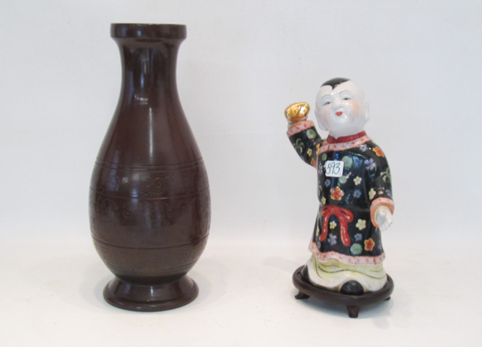 Appraisal: CHINESE PORCELAIN FIGURAL SCULPTURE AND A POTTERY VASE The hand