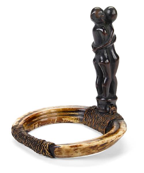 Appraisal: A Kankanaey wood fiber and boar's tusk armlet Philippines height