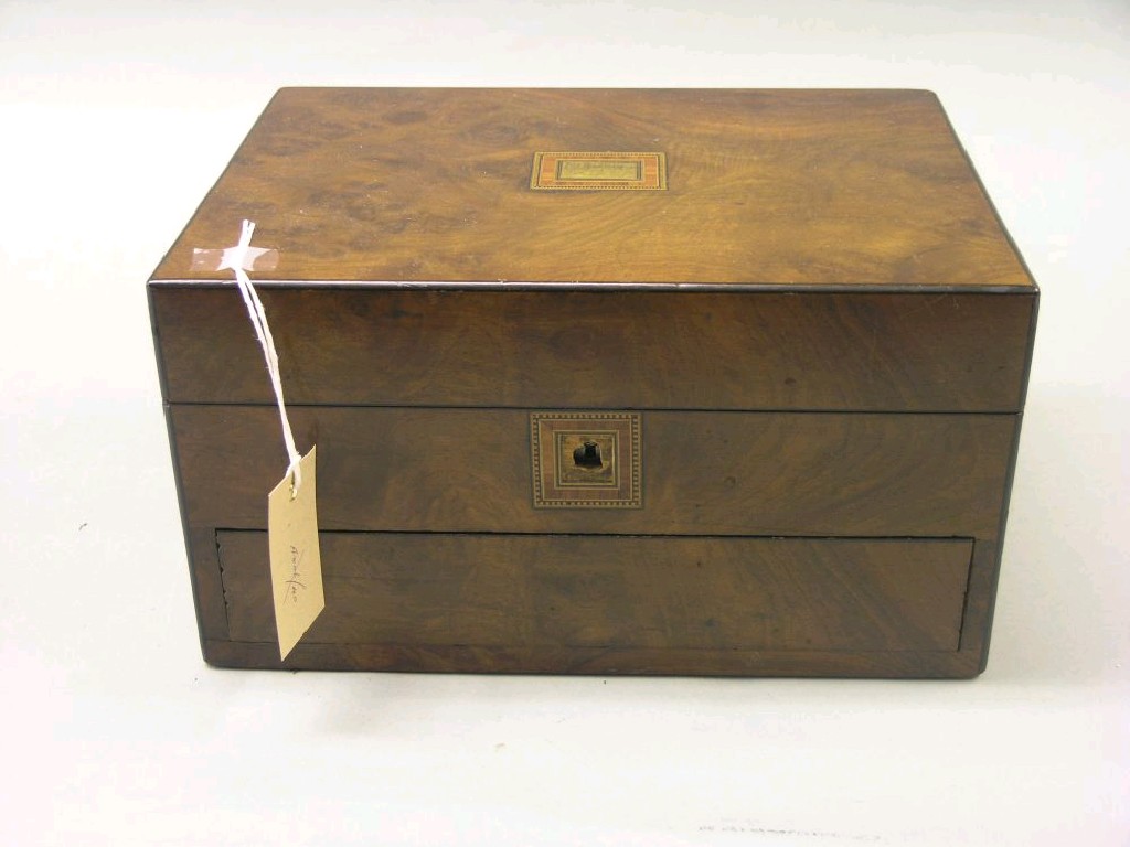 Appraisal: A Victorian walnut veneered jewellery work box with spring-loaded drawers