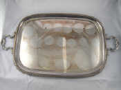 Appraisal: A silver plated two handled tray with gadrooned border and