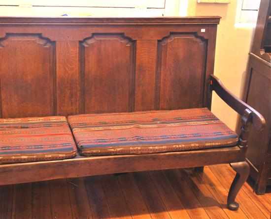 Appraisal: An th century English oak settle The panelled rectangular back