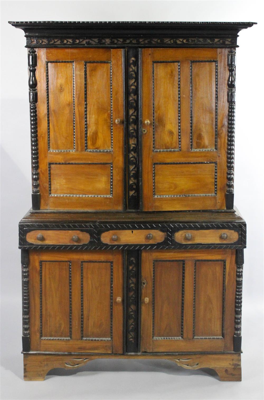 Appraisal: ANGLO COLONIAL MAHOGANY AND EBONY CABINET in two parts of