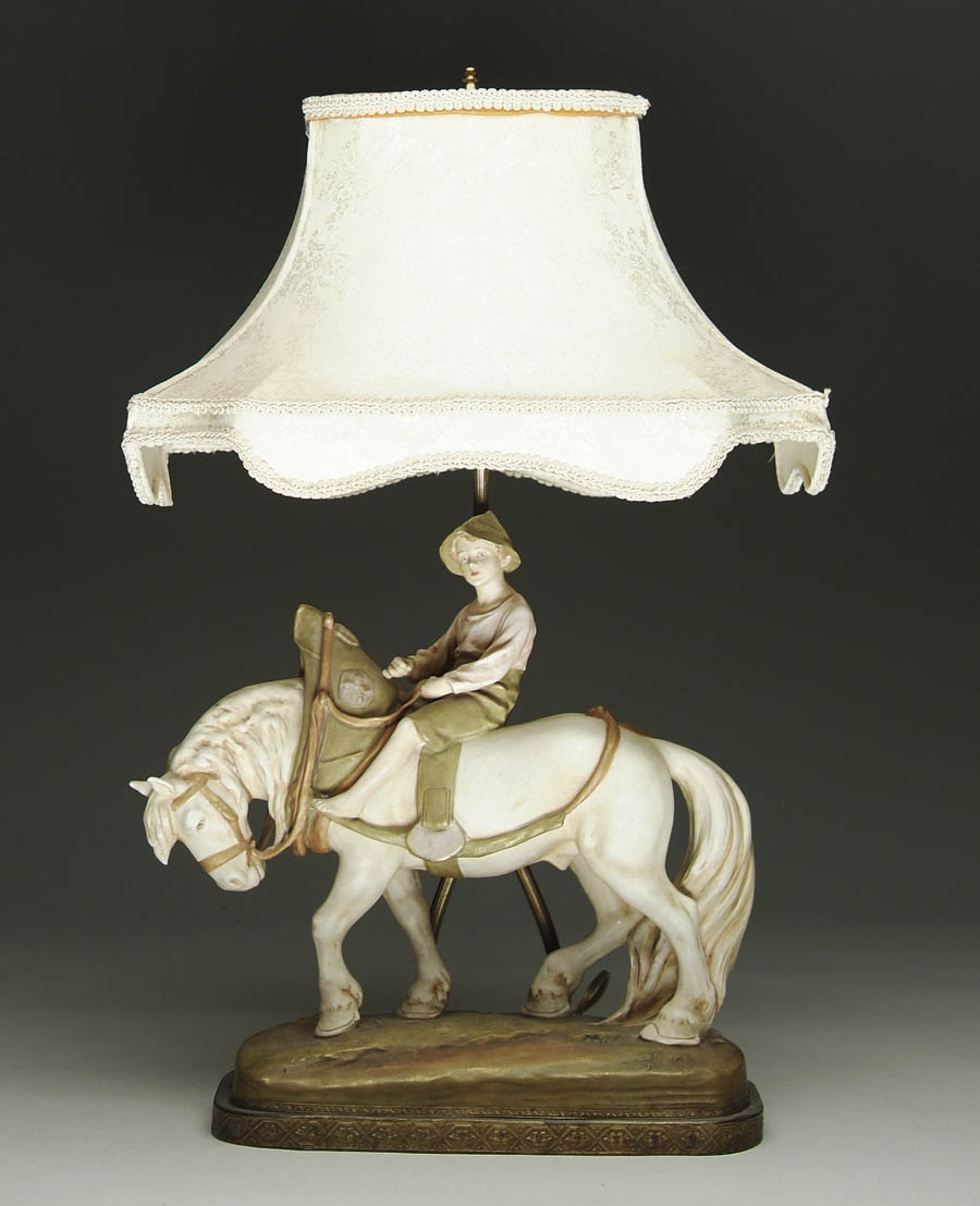 Appraisal: ROYAL DUX LAMP WITH FIGURE OF A BOY ON A