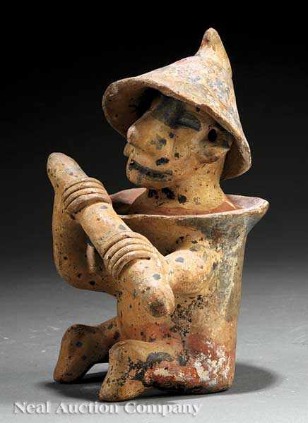 Appraisal: A Pre-Columbian Pottery Guardian Figure Jalisco the seated figure modeled