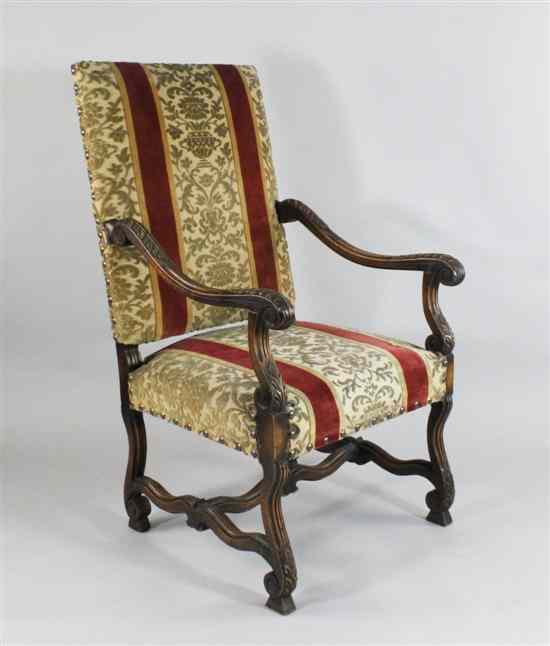 Appraisal: A late th century design carved and stained beech armchair