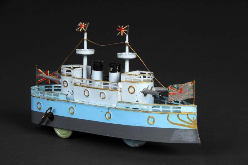 Appraisal: Tin Hand-Painted Battleship Wind-Up Toy Description Japanese Working Includes three