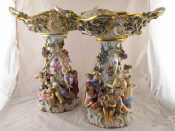 Appraisal: A pair of Meissen 'Four Season' centre pieces the openwork