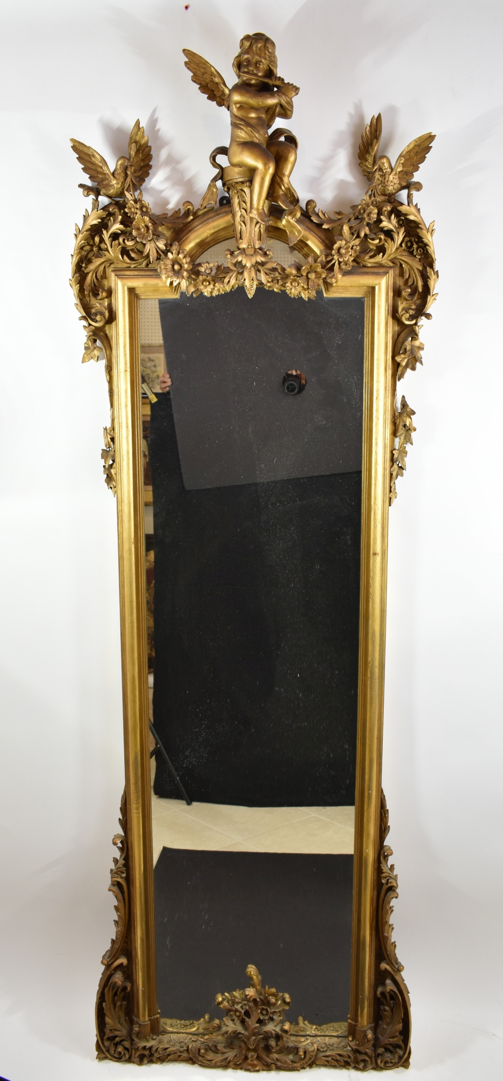 Appraisal: ITALIAN ROCOCO STYLE GILT WOOD PIER MIRRORCirca The tall mirror