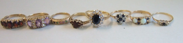 Appraisal: A ct gold and garnet set five stone ring a