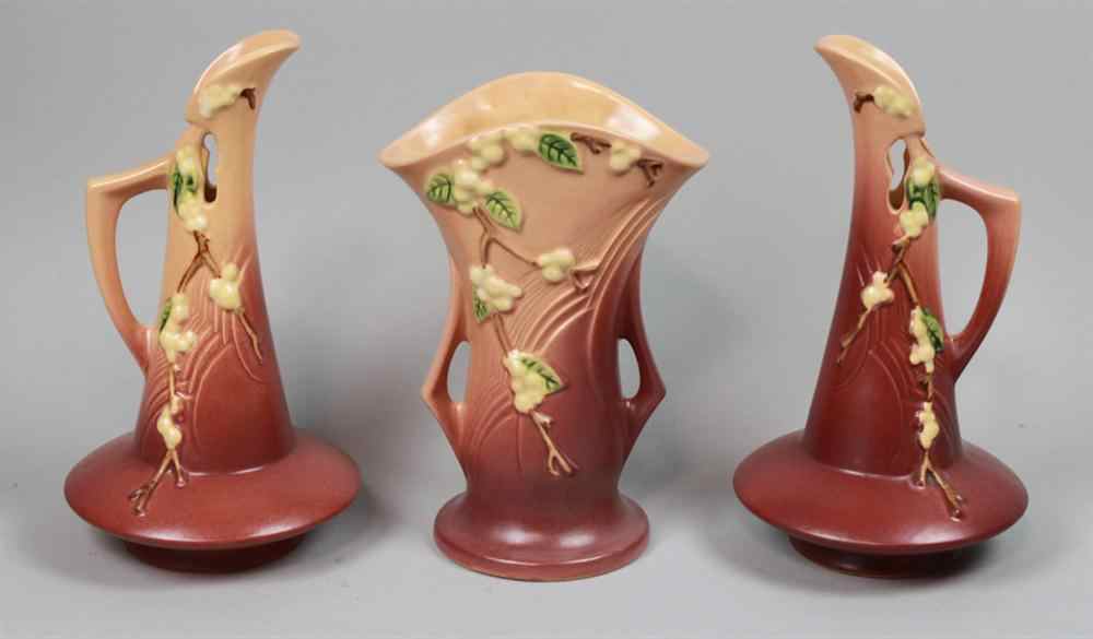 Appraisal: PAIR ROSEVILLE POTTERY PINK SNOWBERRY PATTERN EWERS including a fan