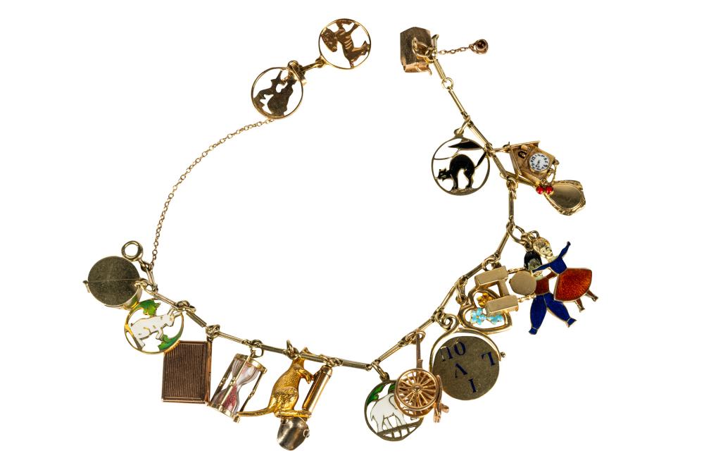 Appraisal: KARAT GOLD ENAMEL CHARM BRACELETcomprising charms the book charm with