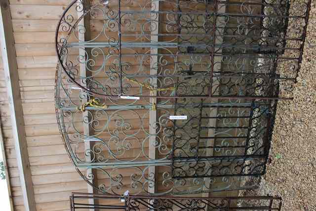 Appraisal: A PAIR OF OLD WROUGHT IRON ENTRANCE GATES with shaped