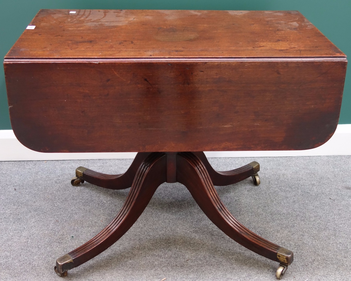 Appraisal: An early th century mahogany drop flap centre table with