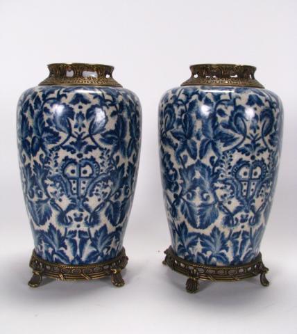 Appraisal: Pair of blue and white stoneware vases with bronze ormolu