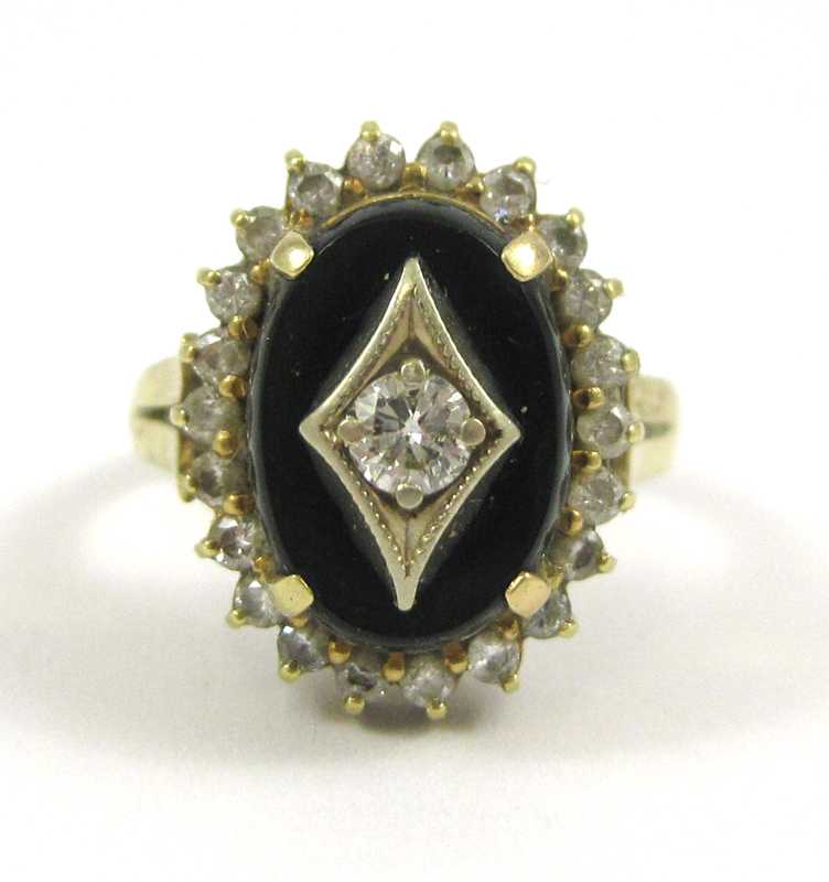 Appraisal: DIAMOND BLACK ONYX AND FOURTEEN KARAT GOLD RING with round-cut