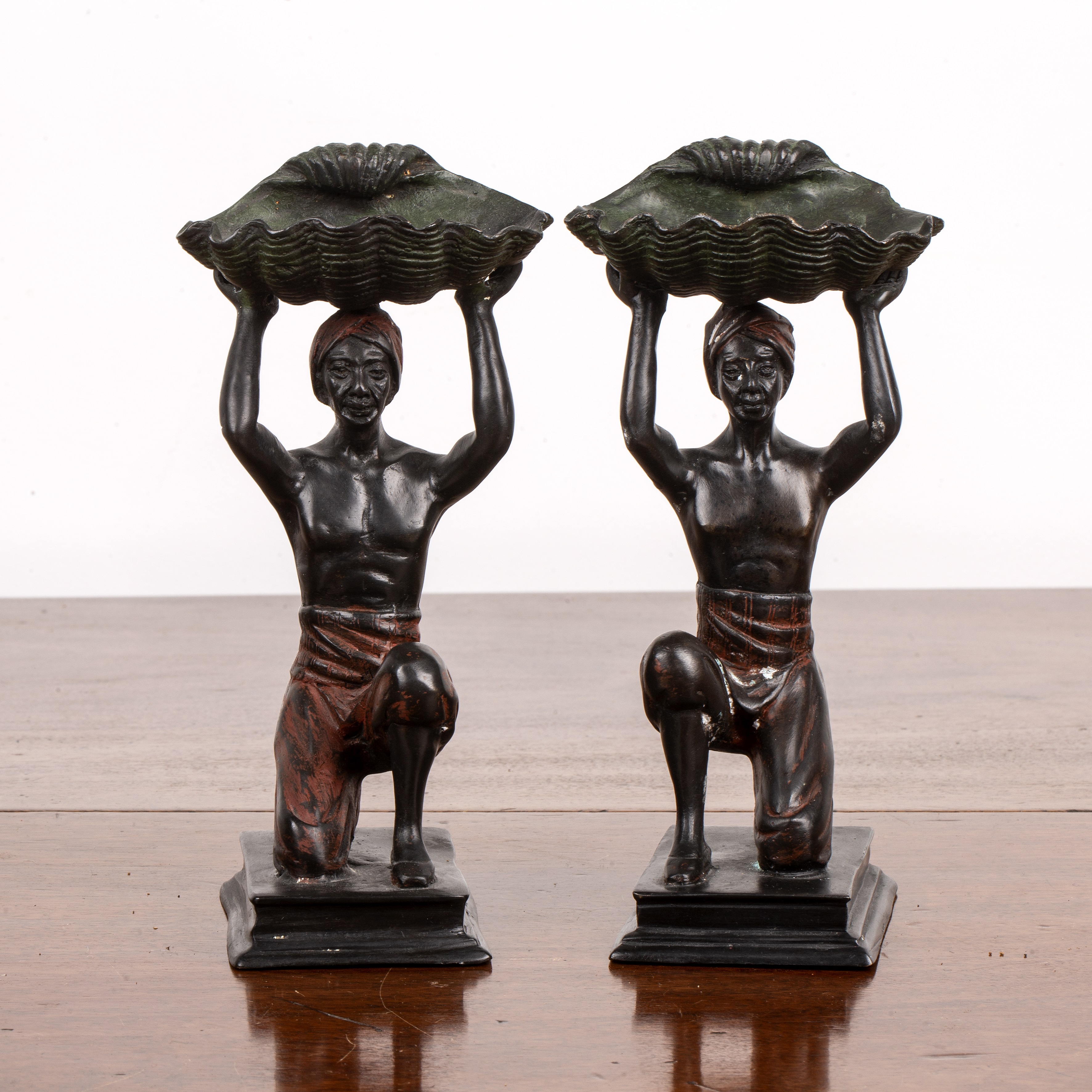 Appraisal: After Franz BergmannPair of cold-painted bronze figures each supporting a