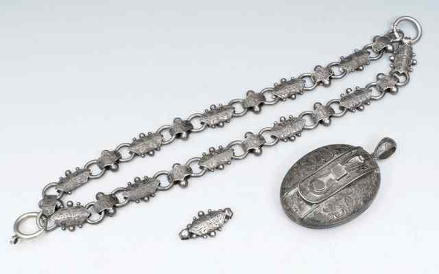 Appraisal: A VICTORIAN SILVER CHOKER with beaded and engraved panels and