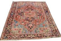 Appraisal: An Early Heriz Carpet C 'S Central medallion carpet with