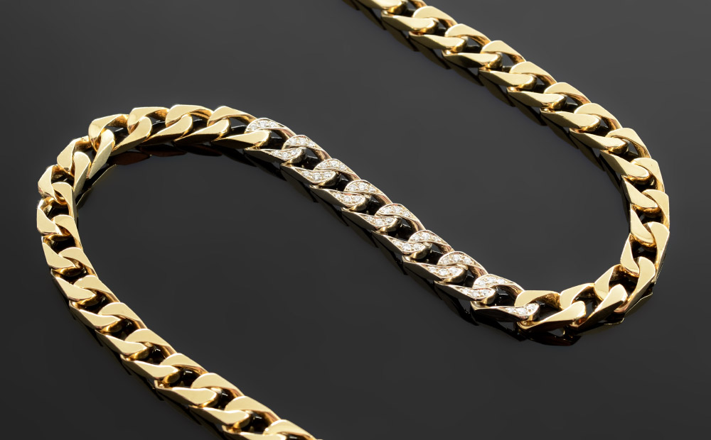 Appraisal: K CUBAN LINK NECKLACE WITH DIAMONDS K yellow gold links