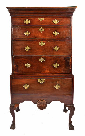 Appraisal: A GEORGE III IRISH MAHOGANY CHEST ON STAND the shallow