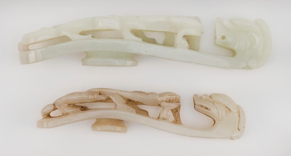 Appraisal: TWO CHINESE CARVED CELADON JADE BELT HOOKS LENGTHS AND TWO