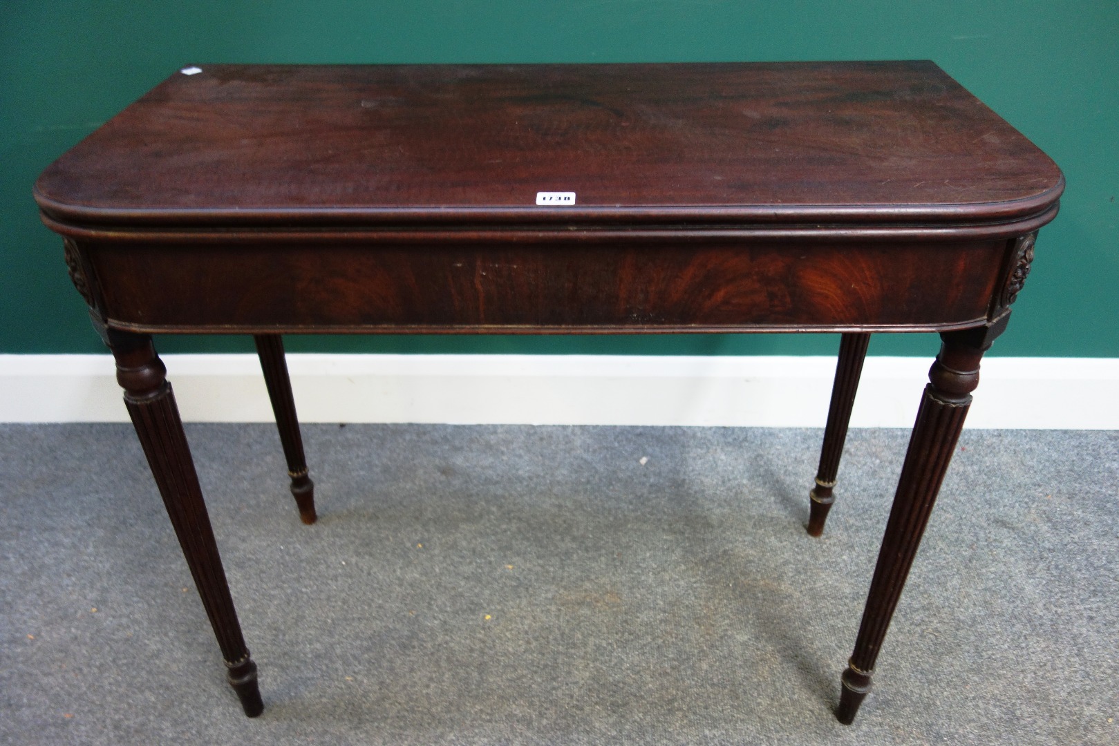 Appraisal: A George III mahogany tea table the fold over rounded