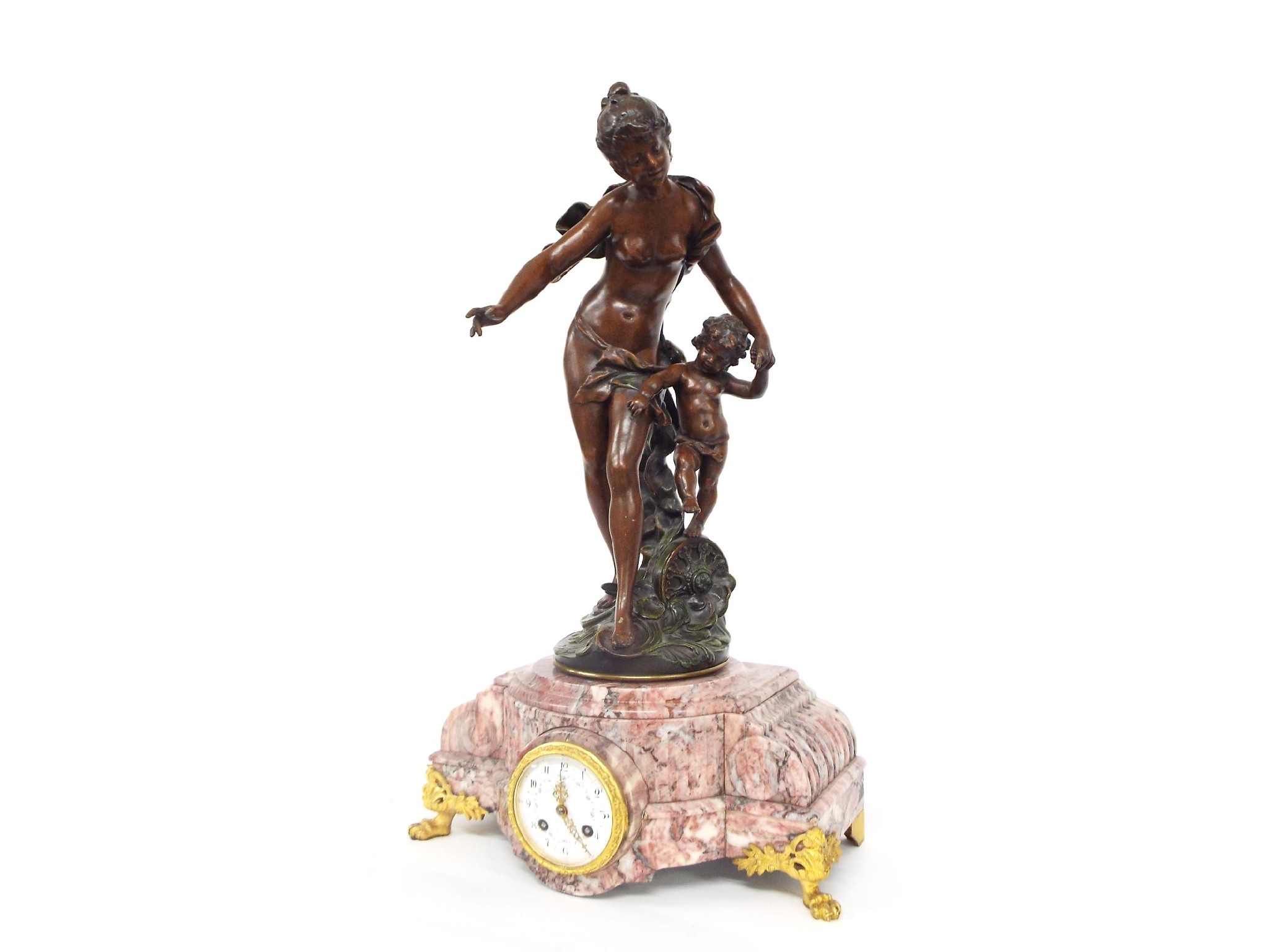 Appraisal: French bronzed and pink marble two train figural mantel clock