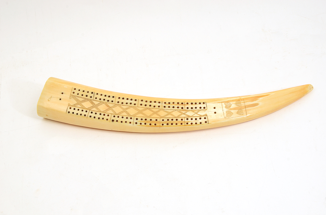 Appraisal: SCRIMSHAW WALRUS TUSK CRIBBAGE BOARD Inuit style cribbage board with