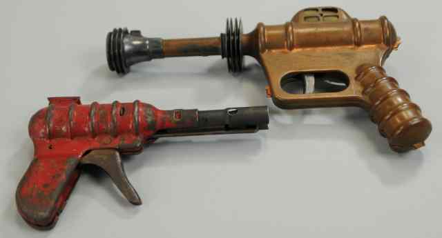 Appraisal: TWO TOY SPACE PISTOLS Includes Daisy Disintegrator in pressed steel