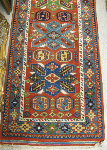 Appraisal: TURKISH RUNNER hand knotted in an overall geometric design '