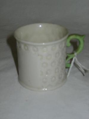 Appraisal: A BELLEEK PORCELAIN MINIATURE MUG with green scroll loop handle