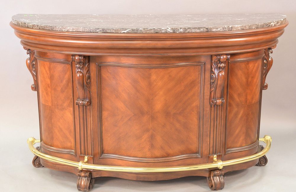 Appraisal: Contemporary mahogany bar with granite veneered top having brass foot