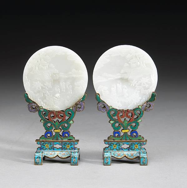 Appraisal: A pair of carved white jade circular plaques and cloisonn