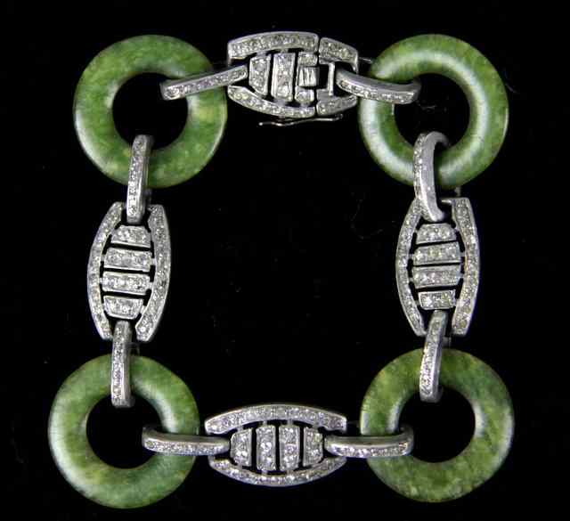 Appraisal: A bracelet of alternating paste set and faux jade links