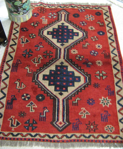 Appraisal: TWO PERSIAN SHIRAZ AREA RUGS hand knotted in a geometric