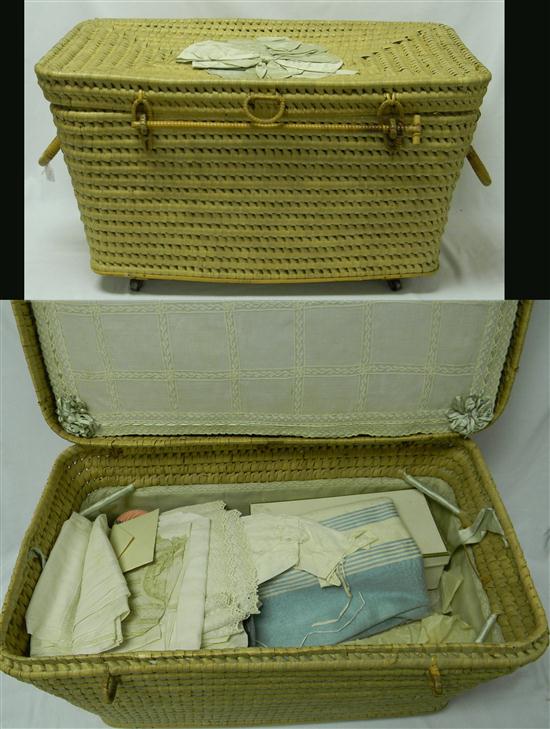 Appraisal: TEXTILES baby's traveling wicker basket complete with blue satin ribbons