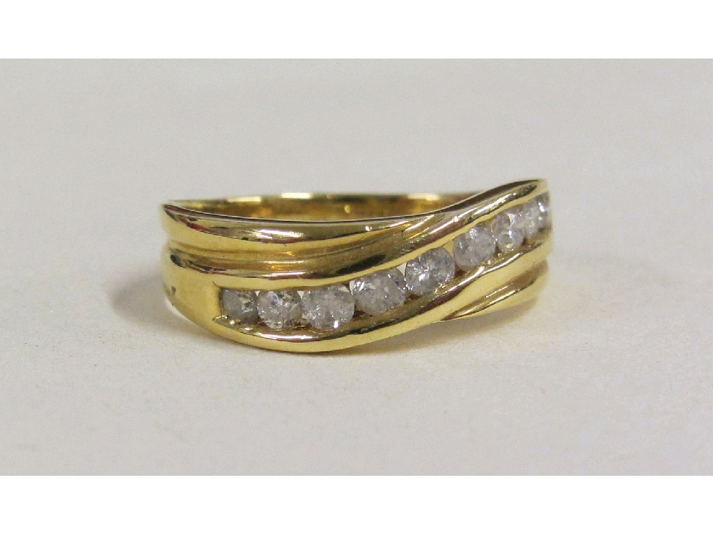 Appraisal: Eighteen carat gold channel set diamond rings with diamonds together