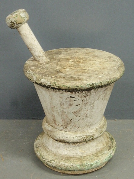 Appraisal: - Large th c carved wood mortar pestle with an