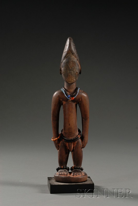 Appraisal: African Carved Wood Ibeji Doll Yoruba the male form with