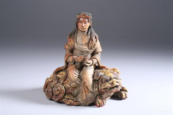 Appraisal: JAPANESE STONEWARE FIGURE OF IMMORTAL AND SHI SHI Seated on