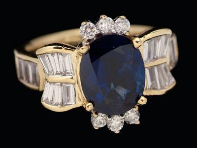 Appraisal: Sapphire diamond ring central oval sapphire estimated weight cts surrounded