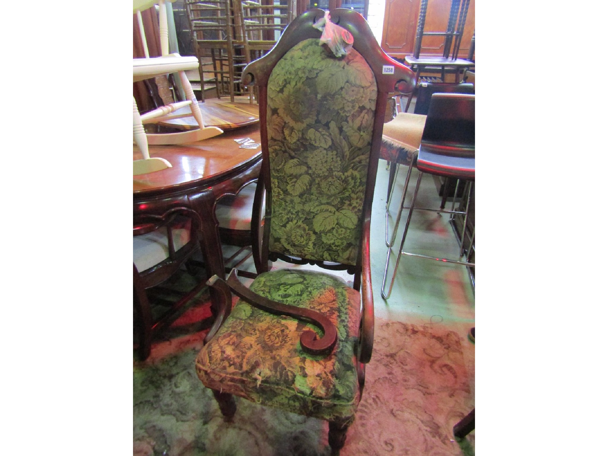 Appraisal: A Victorian high back chair with upholstered seat scrolled open