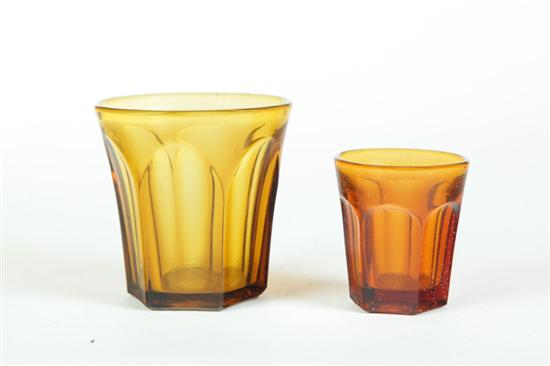 Appraisal: TUMBLER AND TASTER American th century Paneled amber Taller has