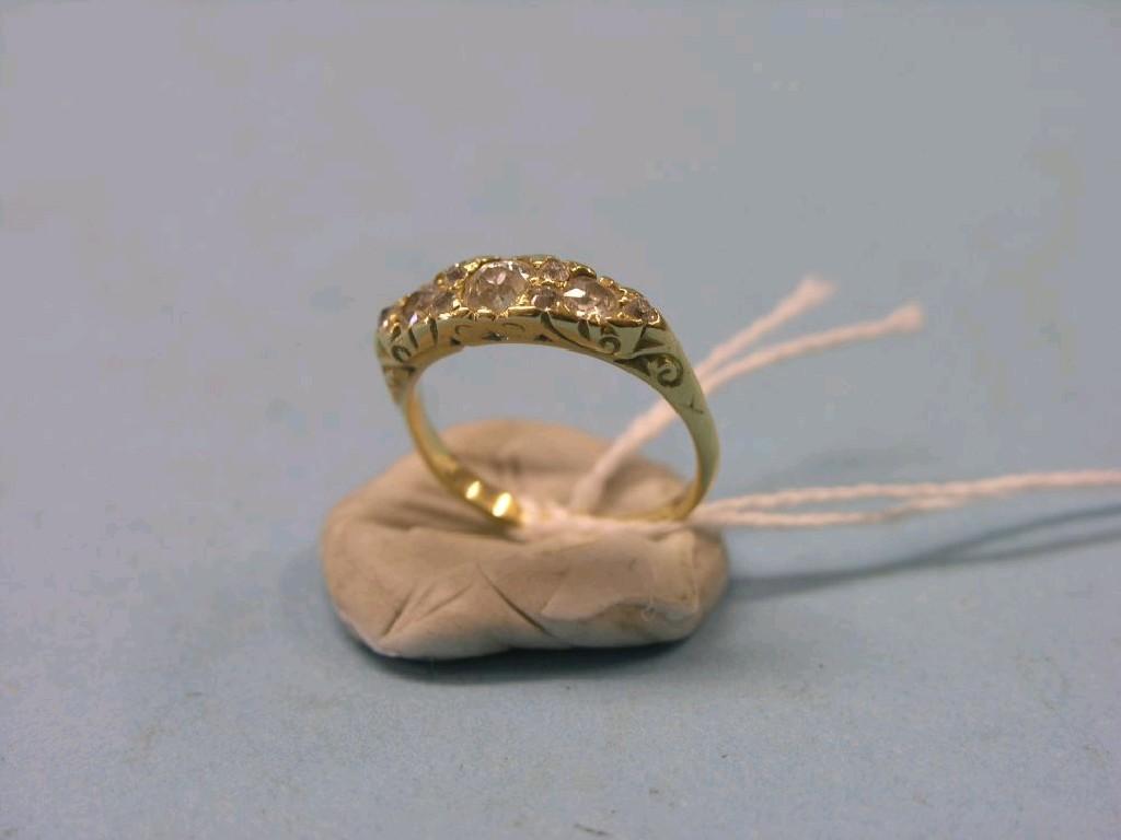 Appraisal: A Victorian Edwardian yellow metal and diamond half-hoop ring nine