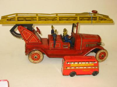 Appraisal: A German fire engine clockwork operated battery lights AF extending