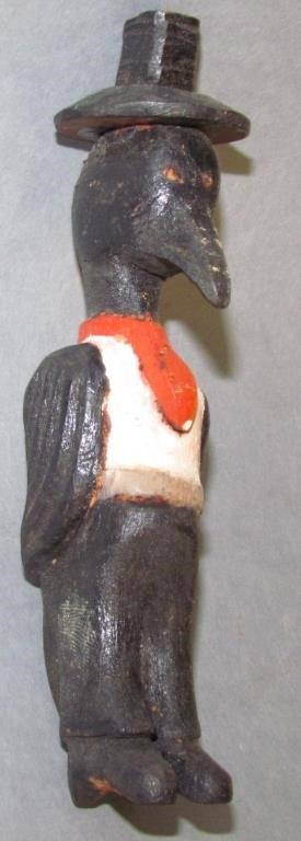 Appraisal: FOLK ART CARVED BIRD WEARING A TOP HAT minor wear