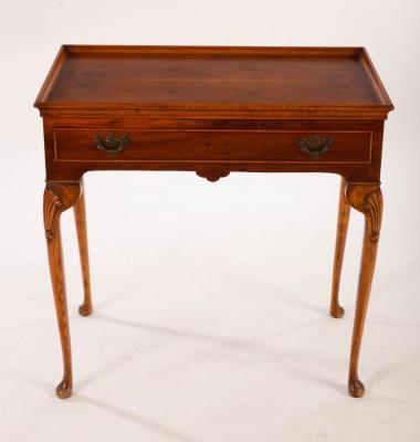 Appraisal: A reproduction silver table fitted a single drawer on cabriole